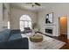 Bright living room with fireplace, vaulted ceiling, and a large window at 5055 Hickory Hills Dr, Woodstock, GA 30188