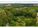 Aerial view of a lush green neighborhood with walking path and green space at 1655 Arrowhead Ne Trl, Atlanta, GA 30345