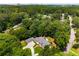 Aerial view of the estate, surrounded by mature trees and lush landscaping at 1655 Arrowhead Ne Trl, Atlanta, GA 30345