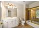 Bathroom showcasing a glass-door shower, a built-in bathtub and a white vanity at 1655 Arrowhead Ne Trl, Atlanta, GA 30345