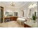 Elegant bathroom showcasing dual vanities, a soaking tub, stained glass window, and granite countertops at 1655 Arrowhead Ne Trl, Atlanta, GA 30345
