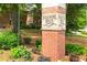 Sagamore Hills brick community entrance sign, framed by lush green landscaping and mature trees at 1655 Arrowhead Ne Trl, Atlanta, GA 30345