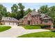 Beautiful brick house with attached three-car garage and well-maintained landscaping at 1655 Arrowhead Ne Trl, Atlanta, GA 30345