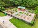 Community garden featuring multiple raised beds, a tool shed, and lush vegetation at 1655 Arrowhead Ne Trl, Atlanta, GA 30345