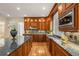 Gourmet kitchen with granite counters, custom cabinets, a central island, and stainless steel appliances at 1655 Arrowhead Ne Trl, Atlanta, GA 30345