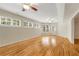 Spacious living room with hardwood floors, multiple windows, and a door to the backyard at 1655 Arrowhead Ne Trl, Atlanta, GA 30345