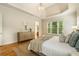 Spacious main bedroom offering a tray ceiling, neutral tones, and hardwood floors at 1655 Arrowhead Ne Trl, Atlanta, GA 30345
