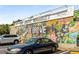 View of the Oak Grove Market featuring colorful mural and a variety of fresh food at 1655 Arrowhead Ne Trl, Atlanta, GA 30345