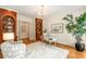 Home office featuring built-in bookshelves and a chandelier at 1655 Arrowhead Ne Trl, Atlanta, GA 30345