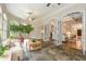 Bright sunroom with slate floors and numerous arched windows, providing seamless transition into the elegant living spaces at 1655 Arrowhead Ne Trl, Atlanta, GA 30345