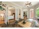 Open sunroom featuring slate tile flooring, arched windows and doors that offer natural light and views at 1655 Arrowhead Ne Trl, Atlanta, GA 30345