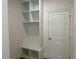 Entryway featuring a built-in mudroom bench with cubbies and hooks for organization at 1114 Low Water Crossing, Acworth, GA 30101
