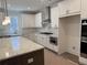 Modern kitchen featuring granite countertops, stainless steel appliances, and white cabinets at 1114 Low Water Crossing, Acworth, GA 30101