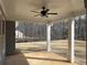 Covered patio with a ceiling fan overlooking a spacious backyard and wooded area at 1114 Low Water Crossing, Acworth, GA 30101