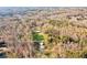 Aerial view showcasing the property's large land and equestrian facilities at 450 Pat Rich Dr, Canton, GA 30115