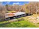 Rustic barn featuring a metal roof and wooden siding at 450 Pat Rich Dr, Canton, GA 30115