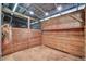 Empty horse stall with wooden walls and hay rack at 450 Pat Rich Dr, Canton, GA 30115