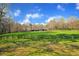 Picturesque view of a barn nestled in a lush green pasture at 450 Pat Rich Dr, Canton, GA 30115