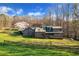 Charming home with a large yard and wooden fence at 450 Pat Rich Dr, Canton, GA 30115