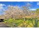 Landscaped yard with flowering trees near barn at 450 Pat Rich Dr, Canton, GA 30115