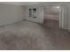 Spacious basement featuring neutral carpet and an attached bonus room for flexible living at 3510 Stonewall Se Pl, Atlanta, GA 30339
