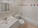Functional bathroom featuring a tub with shower, vanity, and neutral tile at 3510 Stonewall Se Pl, Atlanta, GA 30339