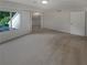 Comfortable carpeted bedroom with a window view and attached bonus room and closet at 3510 Stonewall Se Pl, Atlanta, GA 30339