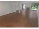 Spacious living room featuring wood floors, large windows, and a fireplace at 3510 Stonewall Se Pl, Atlanta, GA 30339