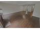 Spacious living room featuring wood floors and a brick fireplace at 3510 Stonewall Se Pl, Atlanta, GA 30339
