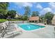 Community pool with lounge chairs, surrounded by lush trees and landscaping at 3510 Stonewall Se Pl, Atlanta, GA 30339