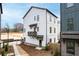 Two-story new construction home with white siding, modern windows, and a small front yard at 3317 Stillwood Ln, Hapeville, GA 30354