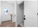 Bright hallway with a coat closet featuring modern finishes and wood-look flooring at 3317 Stillwood Ln, Hapeville, GA 30354
