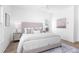 Bright, airy main bedroom with a neutral color scheme and modern decor at 3317 Stillwood Ln, Hapeville, GA 30354
