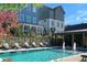Community pool area featuring lounge chairs, fountains, and well-maintained landscaping at 3317 Stillwood Ln, Hapeville, GA 30354