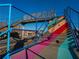 A vibrant stairway with colorful stripes leads over a train track, adding an artistic touch to the urban landscape at 3317 Stillwood Ln, Hapeville, GA 30354