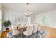 Elegant dining room featuring a large table and chandelier at 211 Colonial Homes Nw Dr # 1303, Atlanta, GA 30309