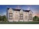 Three-story townhouses with modern design, two-car garages, and landscaped lawn at 2714 Thornwilde Se Ln, Vinings, GA 30339
