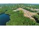 New construction homes with lake views surrounded by lush trees at 3025 Sunset Pass, Canton, GA 30114