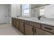 Bright bathroom with double sink vanity and a walk-in shower with black trim at 3025 Sunset Pass, Canton, GA 30114