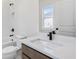 Modern bathroom with a shower and tub combo and quartz countertops at 3025 Sunset Pass, Canton, GA 30114