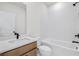 Modern bathroom with a tub, shower, and quartz countertops at 3025 Sunset Pass, Canton, GA 30114