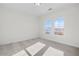 This bedroom has neutral walls, carpeted floors, and natural light at 3025 Sunset Pass, Canton, GA 30114