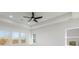 This bedroom has a ceiling fan and multiple windows that let in natural light at 3025 Sunset Pass, Canton, GA 30114