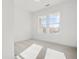 This bedroom has neutral walls, carpeted floors, and natural light at 3025 Sunset Pass, Canton, GA 30114