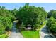 Beautifully landscaped entrance of the community is surrounded by mature trees and green lawns at 3025 Sunset Pass, Canton, GA 30114