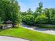A grand entrance with lush landscaping welcomes you to the Great Sky community at 3025 Sunset Pass, Canton, GA 30114