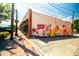 Exterior street view of a local business with a vibrant mural in Canton, Georgia at 3025 Sunset Pass, Canton, GA 30114