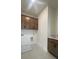 Laundry room with white walls, wooden cabinets, a sink, and a laundry water hookup at 3025 Sunset Pass, Canton, GA 30114