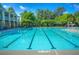 A refreshing outdoor pool with lounge chairs and mature trees, perfect for relaxation and recreation at 3025 Sunset Pass, Canton, GA 30114
