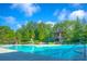 A beautiful community pool featuring a lifeguard stand, lounge chairs, and a slide for hours of fun in the sun at 3025 Sunset Pass, Canton, GA 30114